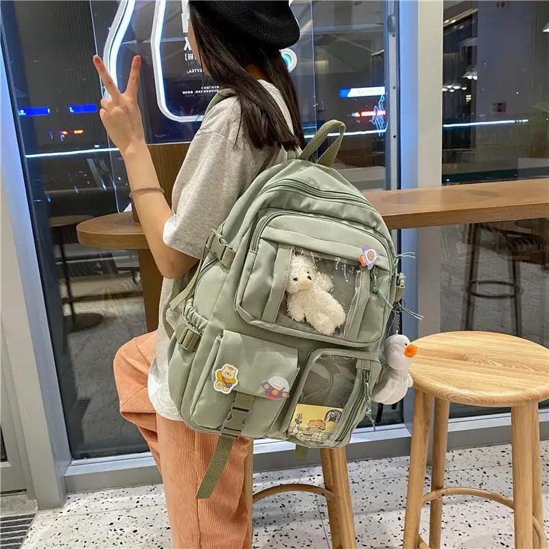 Stevvex nylon waterproof school backpack in sage green with plush teddy charm and front pockets on Tampa Home & Garden Store