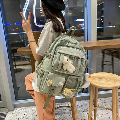 Stevvex nylon waterproof school backpack in sage green with plush teddy charm and front pockets on Tampa Home & Garden Store