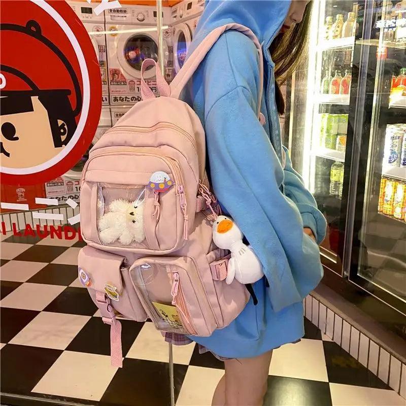 Stevvex pink nylon large-capacity waterproof school backpack with plush charms on Tampa Home & Garden Store