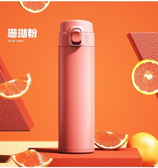 Stevvex coral pink stainless steel thermos bottle with flip lid on Tampa Home & Garden Store