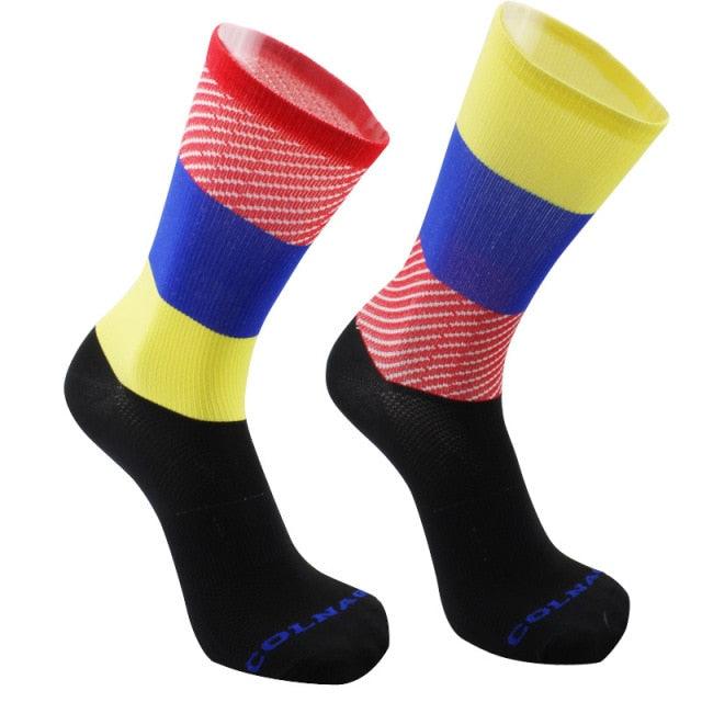 Stevvex cycling socks, pair of color-blocked crew socks in red blue yellow with black feet on Tampa Home & Garden Store