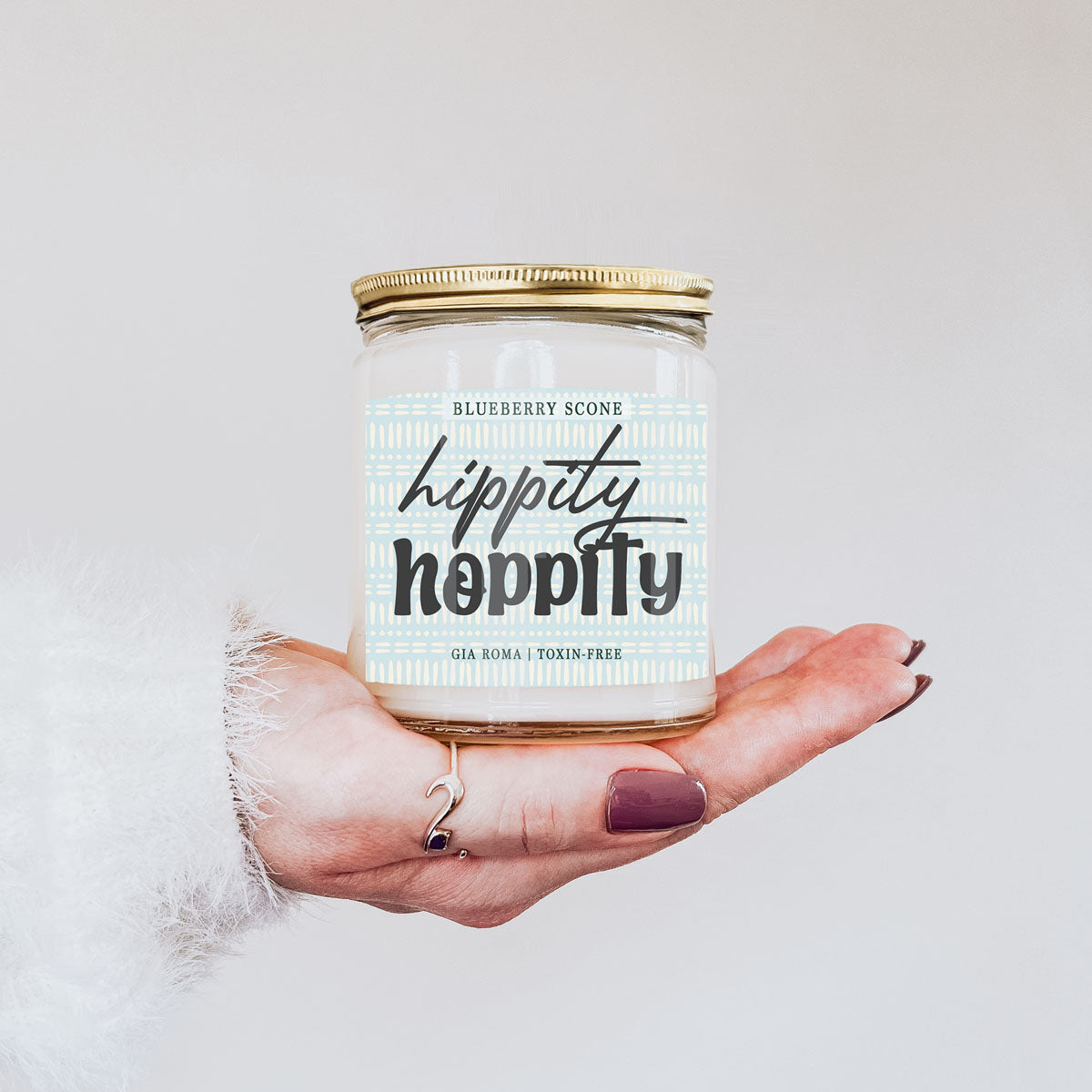Blueberry Scone Candle by Gia Roma in a clear jar with a blue patterned label and gold lid on Tampa Home & Garden Store