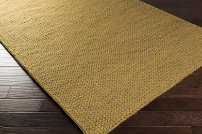 Area rug Hensler, natural tan jute with braided texture on wood floor on Tampa Home & Garden Store