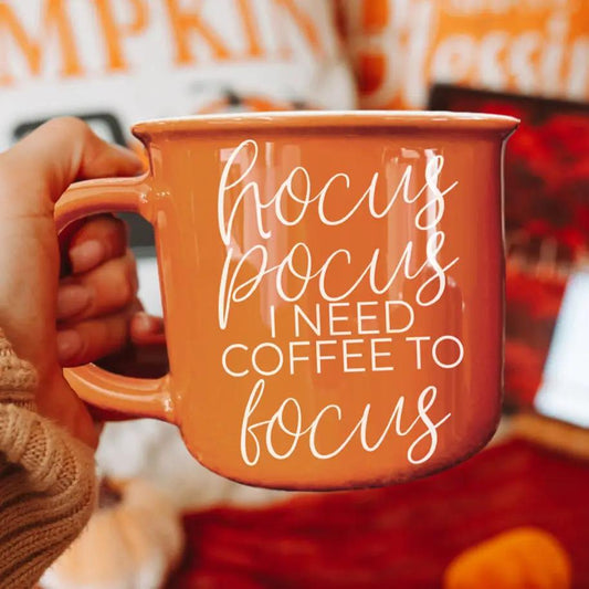Coffee mug orange ceramic Gia Roma with white script hocus pocus I need coffee to focus on Tampa Home & Garden Store