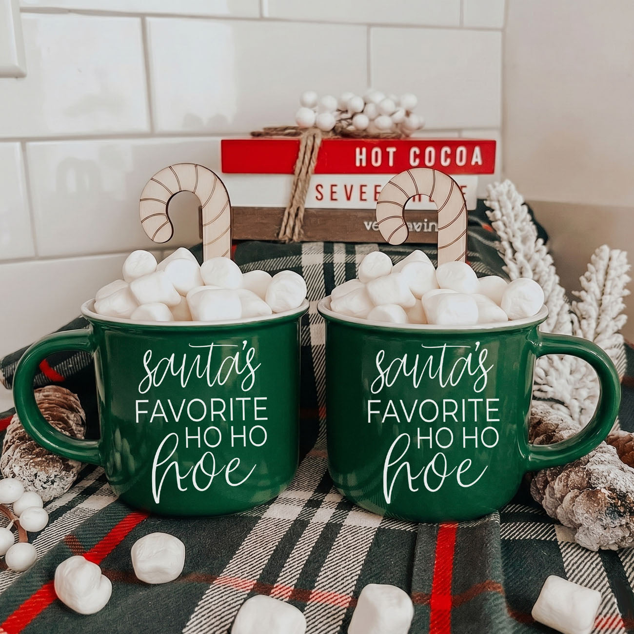 Ho Ho Hoe mug pair in green ceramic by Gia Roma with Santa's Ho Ho Hoe script and marshmallows on Tampa Home & Garden Store
