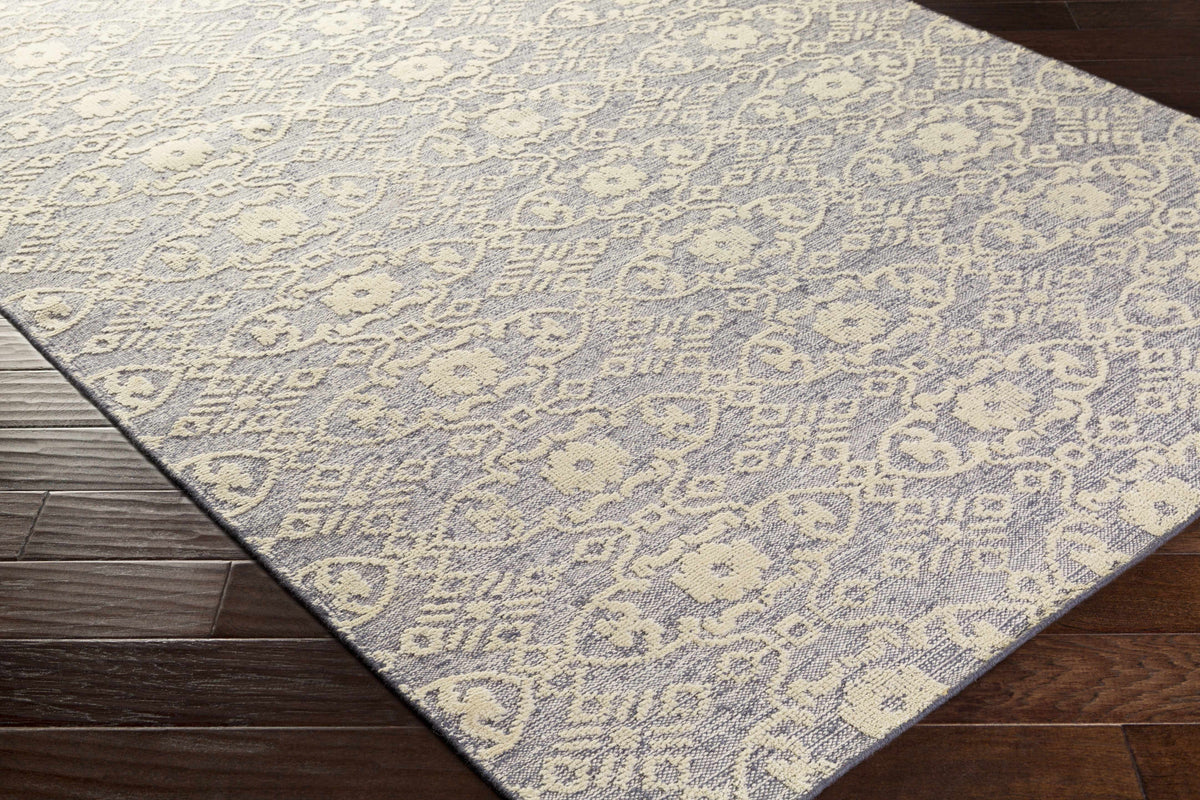 Hoisington Ivory Patterned Wool Rug on gray-blue field by Boutique Rugs on Tampa Home & Garden Store