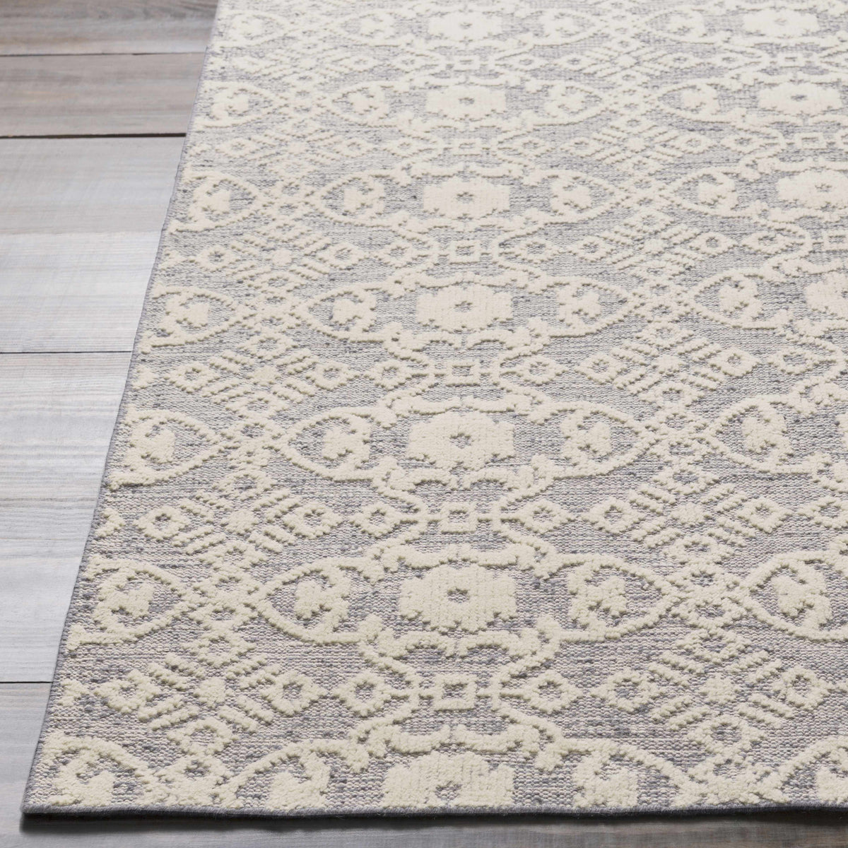 Hoisington Ivory patterned wool rug by Boutique Rugs, ivory pattern on light wood floor, clearance on Tampa Home & Garden Store