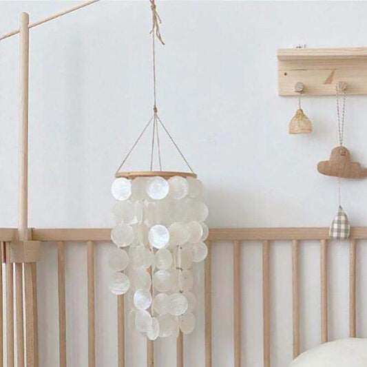 Home Shell Wind Chime with white shell discs and wooden top by Stevvex for nursery decor on Tampa Home & Garden Store