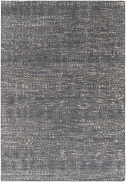 Hoole area rug by Boutique Rugs, dark blue-gray with a subtle textured weave on Tampa Home & Garden Store
