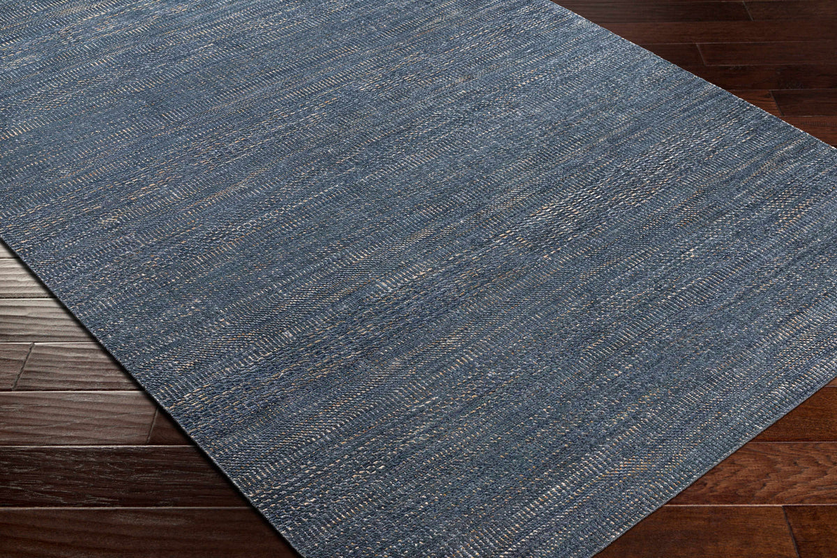 Hoole Area Rug Boutique Rugs blue gray woven texture on dark hardwood floor on Tampa Home & Garden Store