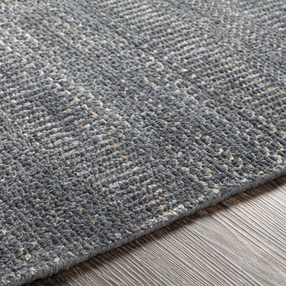 Hoole Area Rug by Boutique Rugs; gray-blue loop pile with beige flecks, textured on wood floor on Tampa Home & Garden Store