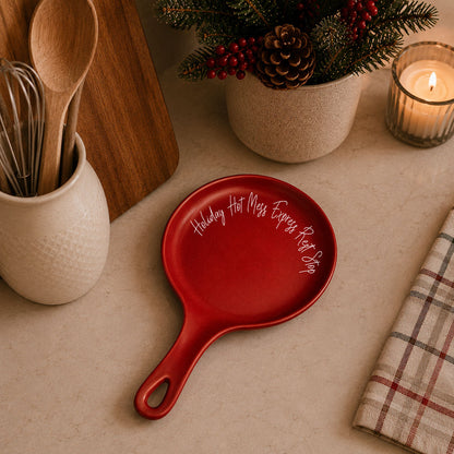 Holiday Hot Mess Spoon Rest by Gia Roma, red round with integrated handle and white cursive text on Tampa Home & Garden Store