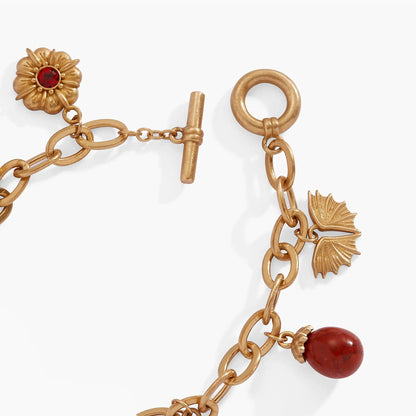 House of the Dragon Toggle Multi-Charm Bracelet gold-tone with red gemstone flower charm on Tampa Home & Garden Store