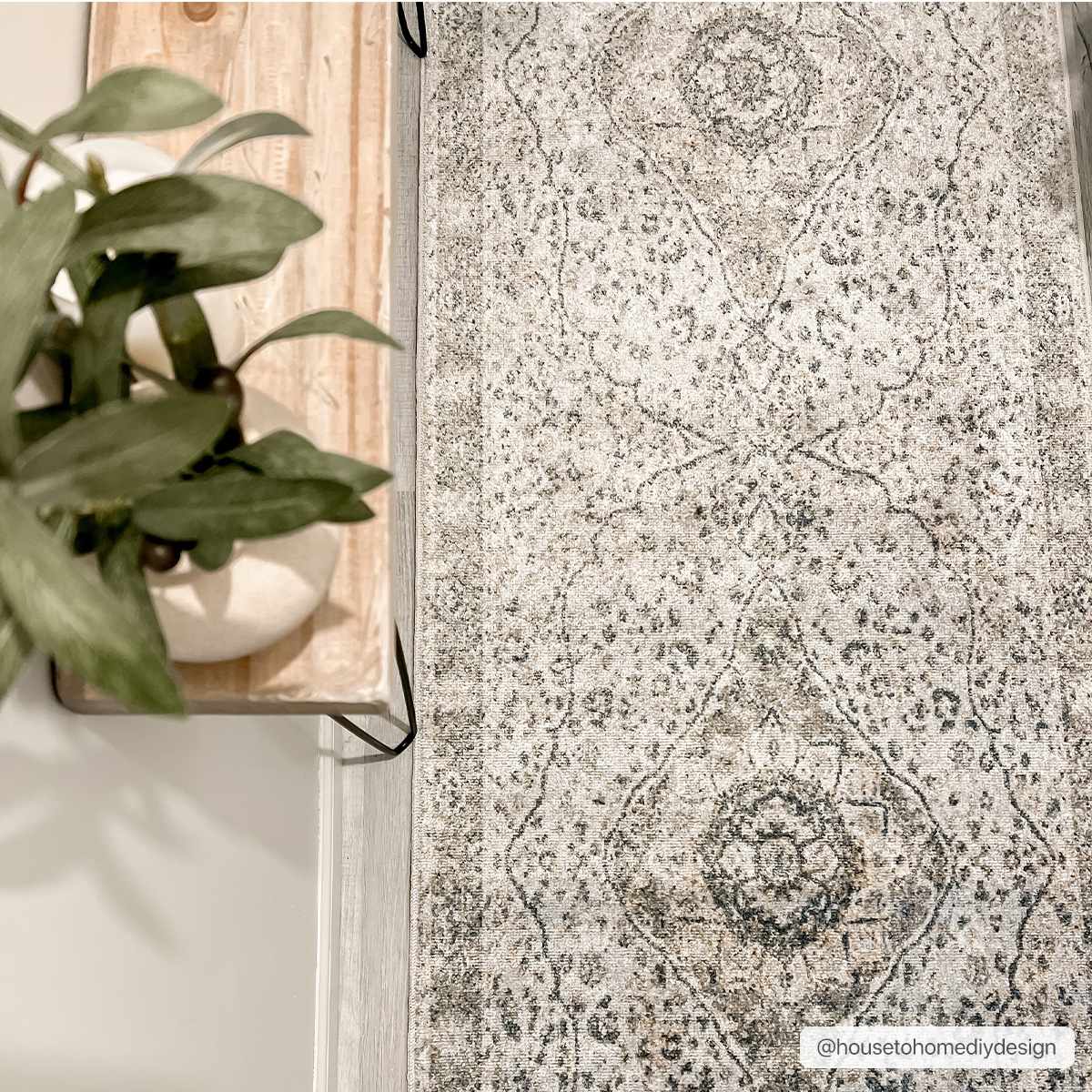 Cara Flat Pile Washable Rug in gray with antique medallion pattern on light floor on Tampa Home & Garden Store