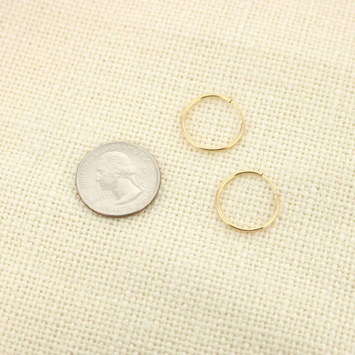 14k yellow gold filled hoop earrings, 17 mm, small gold hoops on beige fabric with three hoops on Tampa Home & Garden Store