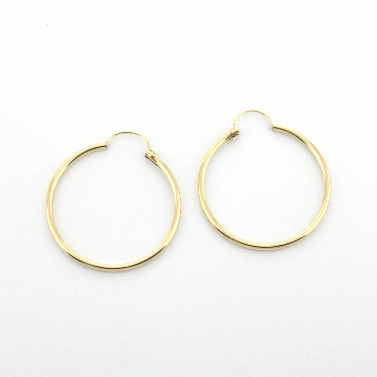 14k yellow gold filled hoop earrings 24 mm, partial view of two hinged hoops on Tampa Home & Garden Store
