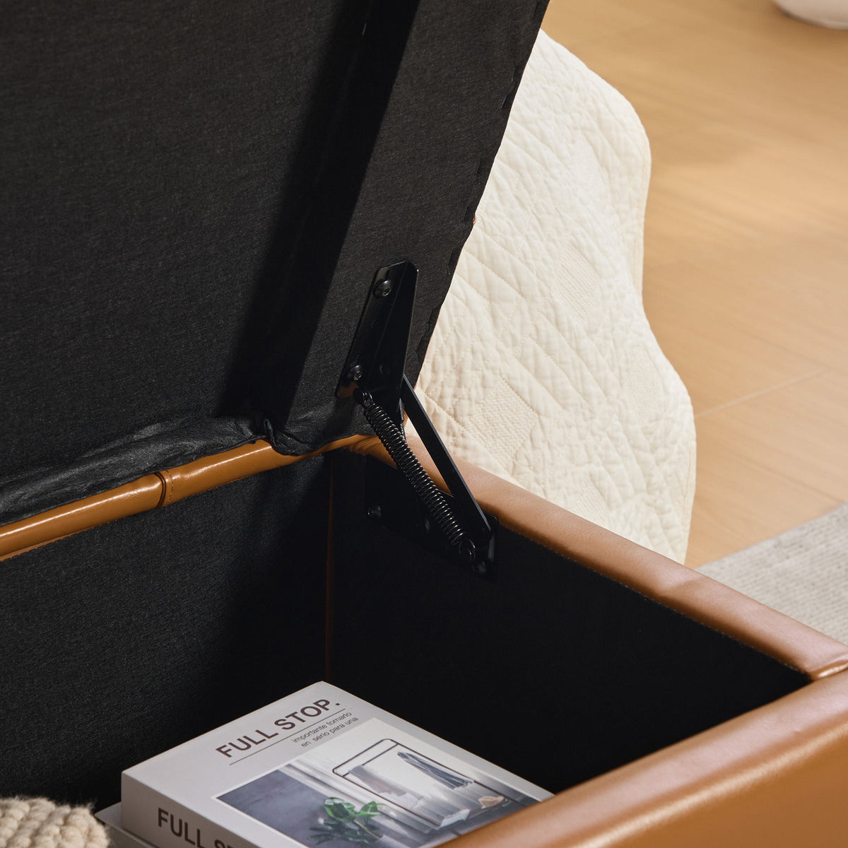 Storage end-of-bed bench in black PU upholstery with flip-top lid and metal hardware on Tampa Home & Garden Store