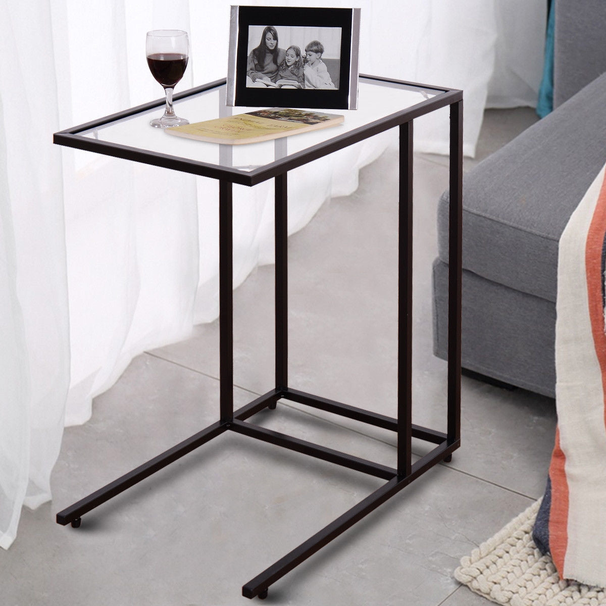 Mesa auxiliar de sofá con superficie de cristal