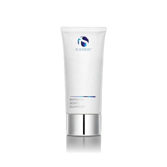 iS CLINICAL Warming Honey Cleanser 4oz tube, white with blue logo, honeycomb design, silver cap on Tampa Home & Garden Store
