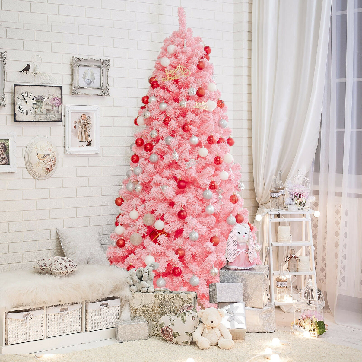 Pink Christmas tree with snow-flocked PVC tips and metal stand, red and silver baubles on Tampa Home & Garden Store