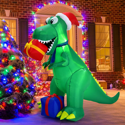 6 Feet Christmas Inflatable Dinosaur by DirectDeals, green holding a red gift outdoors on Tampa Home & Garden Store