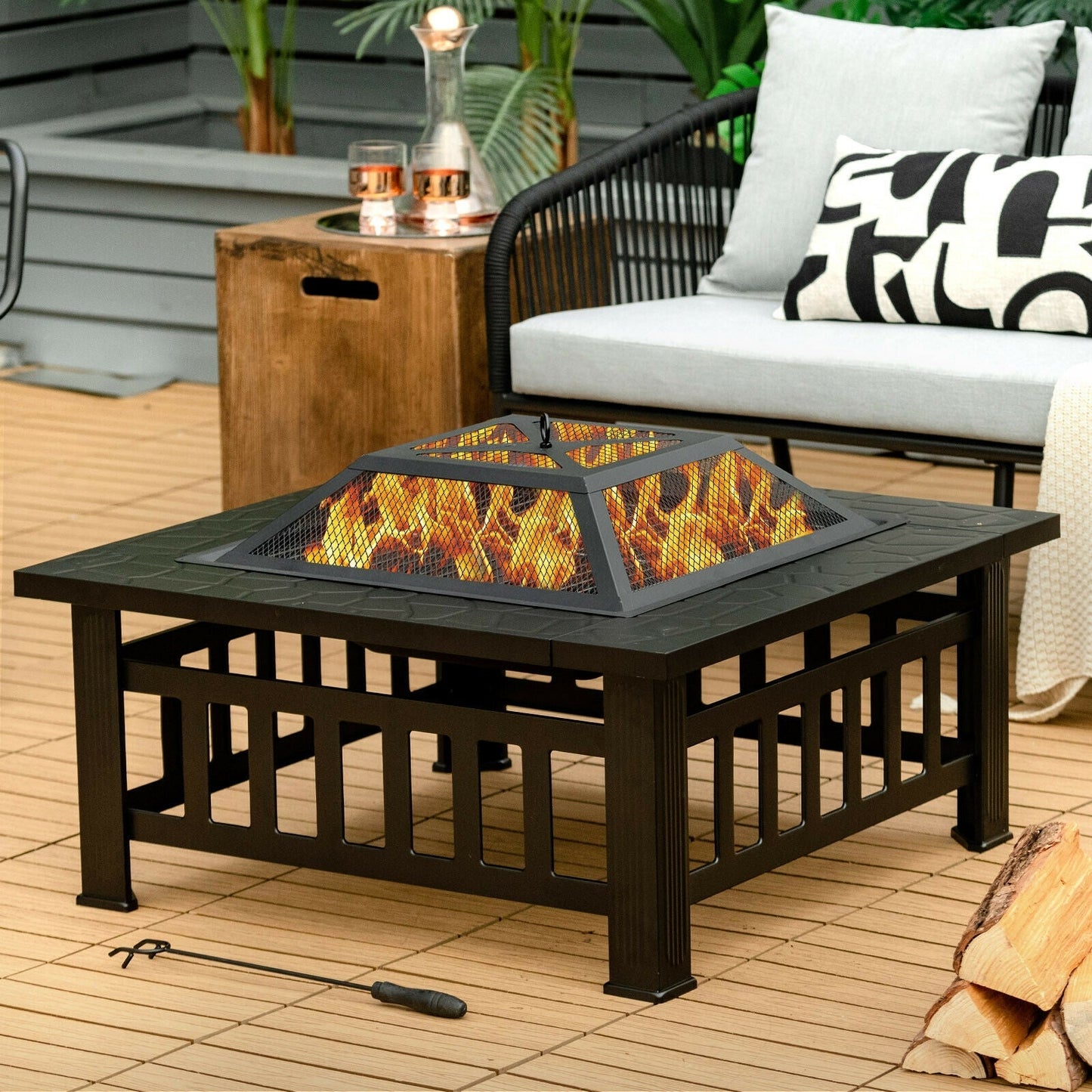 32in outdoor square fire pit table by GemGear with black metal frame and flickering flames on deck on Tampa Home & Garden Store