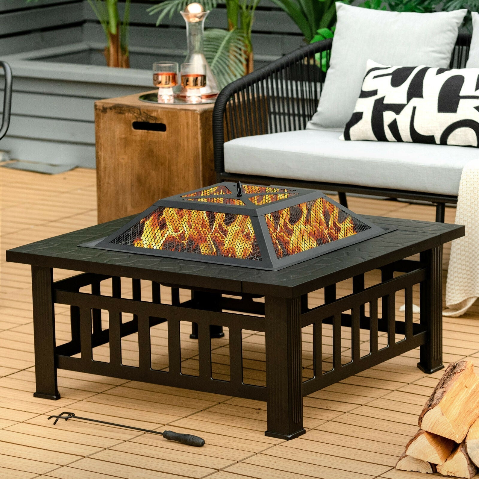 32in outdoor square fire pit table by GemGear with black metal frame and flickering flames on deck on Tampa Home & Garden Store