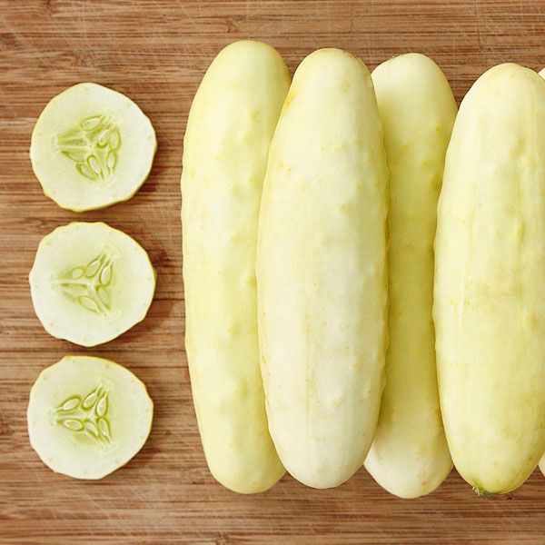 Silver Slicer cucumber seeds Seedtime Store; pale yellow cucumbers with slices on board on Tampa Home & Garden Store