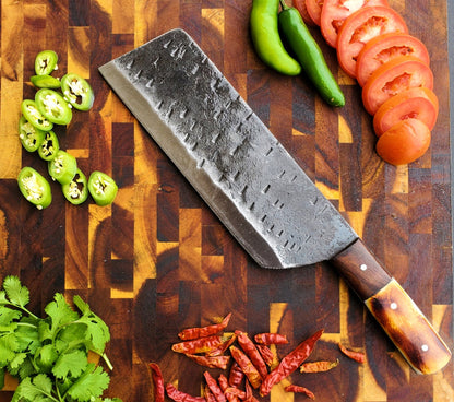 Titan duty carbon steel cleaver with burnt camel bone and walnut handle on cutting board on Tampa Home & Garden Store