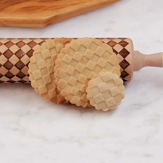 Gia Roma Courtly Check rolling pin with checkerboard pattern; three lattice cookies beside marble on Tampa Home & Garden Store