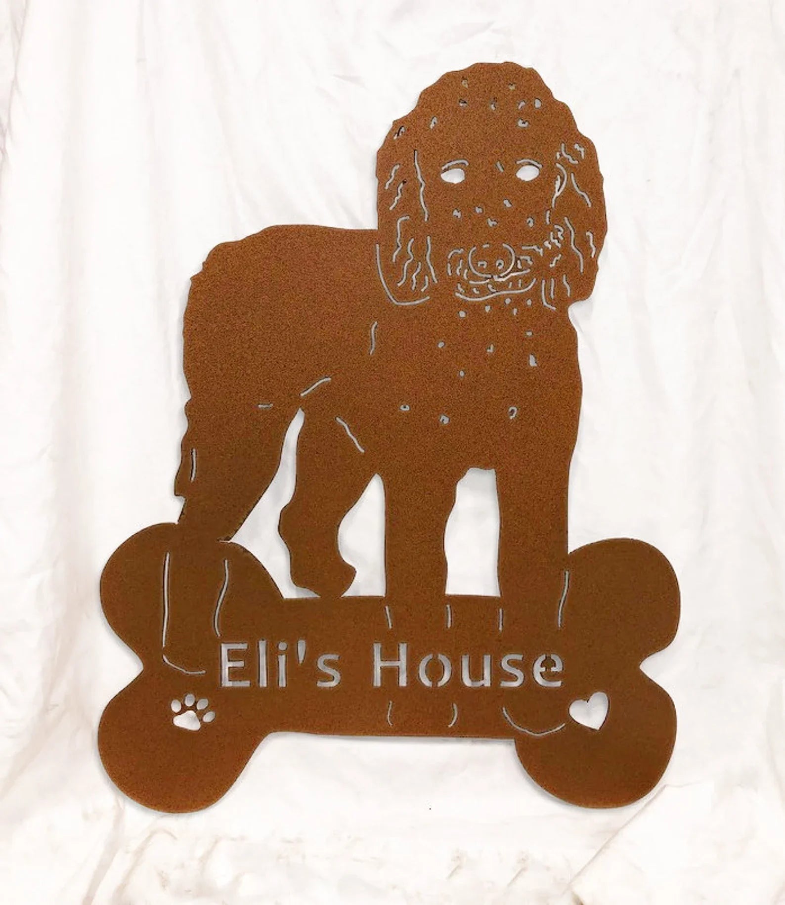 Goldendoodle garden stake silhouette in rust metal with paw prints and bone accents on Tampa Home & Garden Store