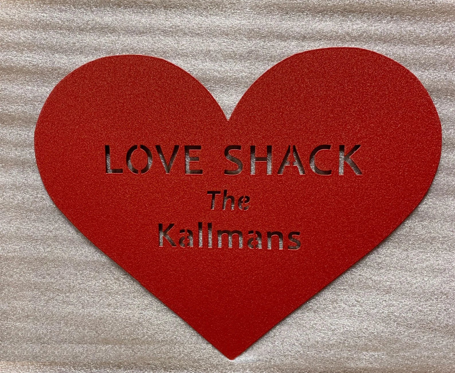 Heart shaped red metal wall art with cutout text LOVE SHACK The Kallmans by Rustica Ornamentals on Tampa Home & Garden Store