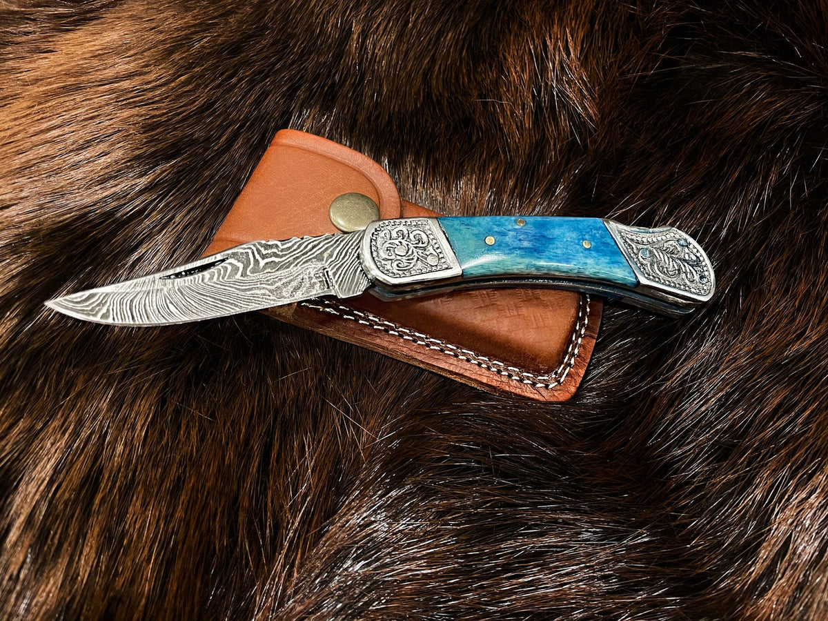 Damascus steel pocket knife with dyed blue bone handle and decorative bolsters TF-010B on Tampa Home & Garden Store