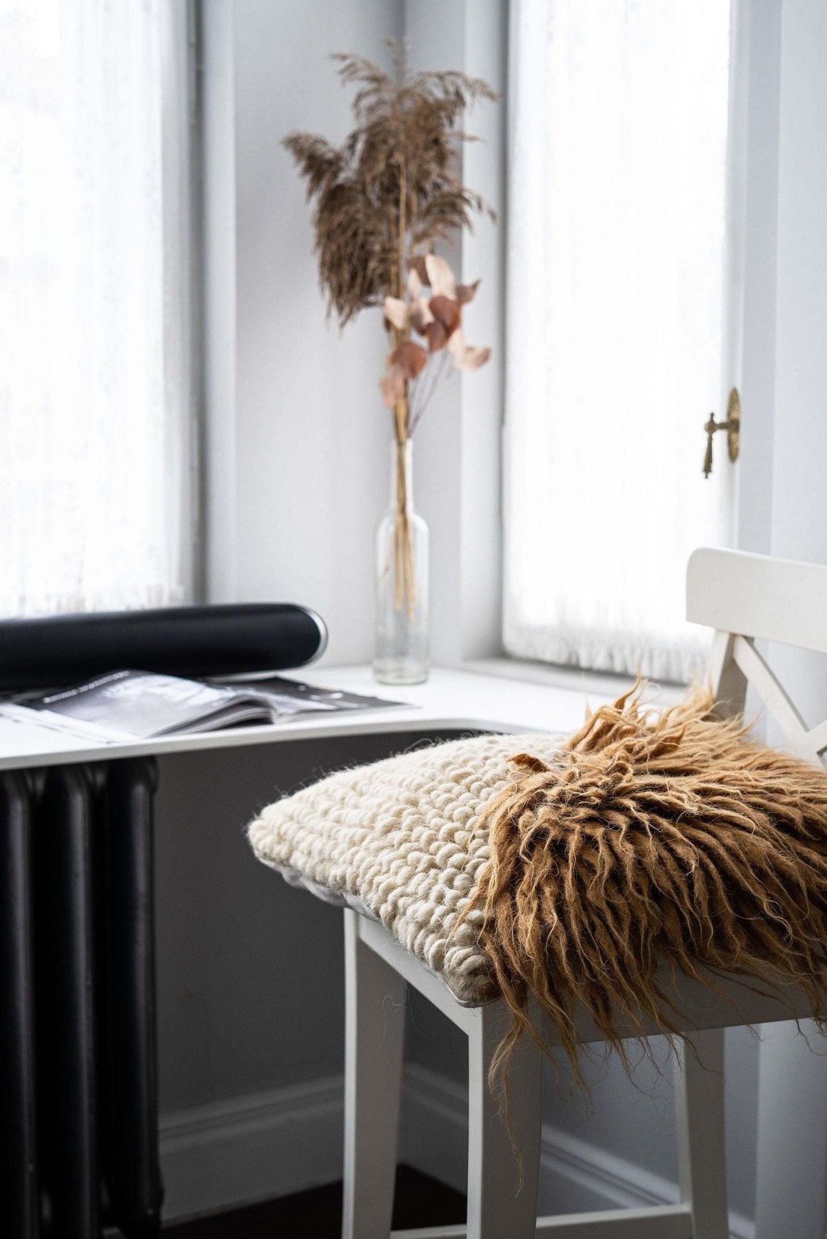 Pillow Forest Bark by Creating Comfort; chunky beige knit with brown fringe on white chair on Tampa Home & Garden Store