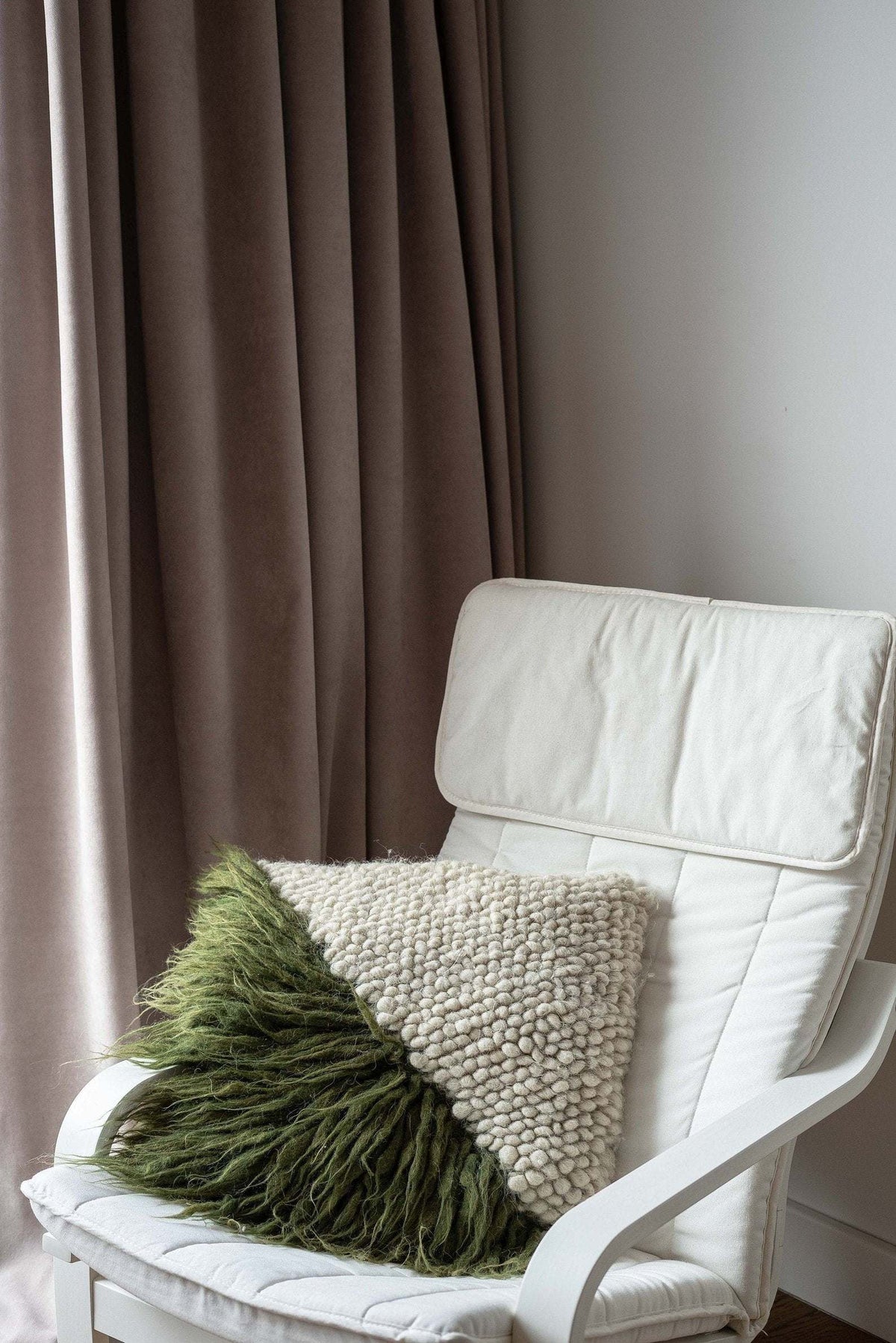 Pillow Forest Bark by Creating Comfort on a white chair with beige knit pillow and taupe drapes on Tampa Home & Garden Store