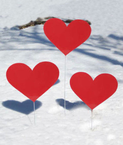 Heart garden stakes set of 3 by Rustica Ornamentals, bright red heart shapes in snowy yard on Tampa Home & Garden Store