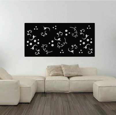 Large black metal wall decor panel with white ornamental scrollwork on Tampa Home & Garden Store