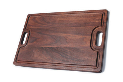 Walnut cutting board with juice groove and built-in handles for serving on Tampa Home & Garden Store