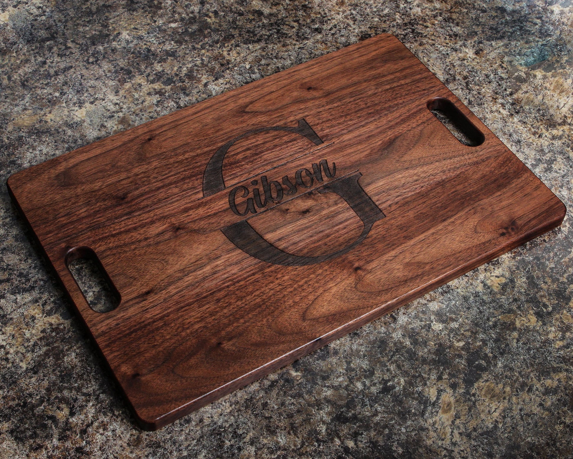 Gibson engraved cutting board with monogram frame and handle cutouts on granite counter on Tampa Home & Garden Store