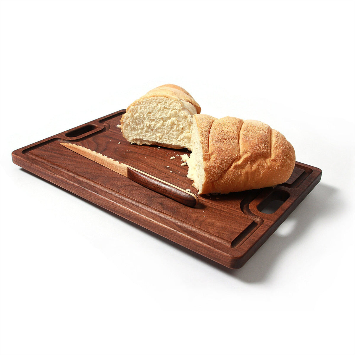 Cutting board with juice groove and handles, dark walnut wood with bread loaf on Tampa Home & Garden Store