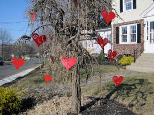 Hanging Heart Tree Ornaments set of 3 red hearts on a bare tree in a front yard on Tampa Home & Garden Store
