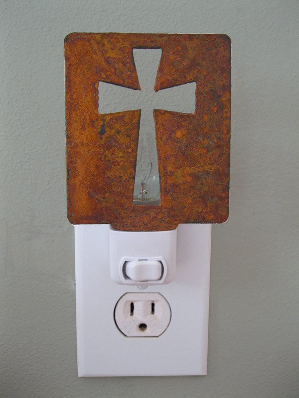 Cross Night Light Rustica Ornamentals with rusted cross panel over plug-in night light on Tampa Home & Garden Store