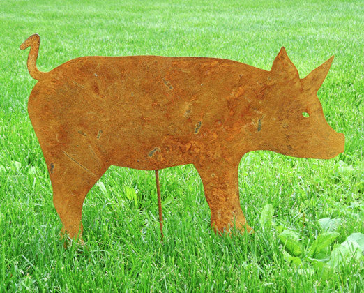 Pig yard art silhouette Rusted metal finish on green lawn by Rustica Ornamentals on Tampa Home & Garden Store