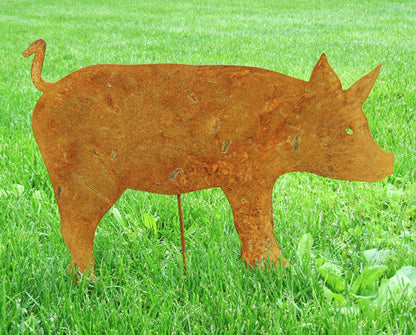 Pig yard art silhouette Rusted metal finish on green lawn by Rustica Ornamentals on Tampa Home & Garden Store
