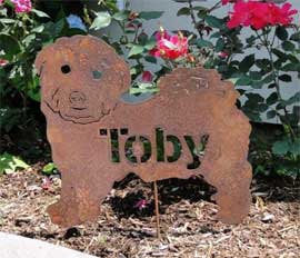 Rust-colored metal dog garden statue with cut-out name Toby on Tampa Home & Garden Store