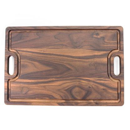 Cutting board by Refine Kitchenware in walnut wood with integrated oval handles on Tampa Home & Garden Store