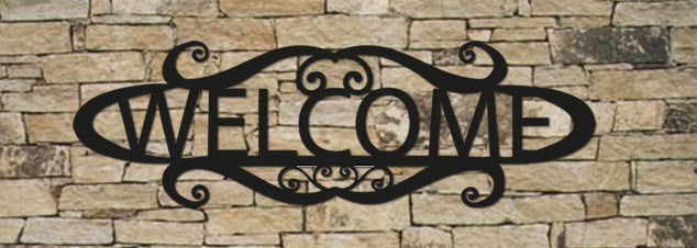 24 Inch Personalized Welcome Sign by Rustica Ornamentals, black metal scrollwork on a stone wall on Tampa Home & Garden Store