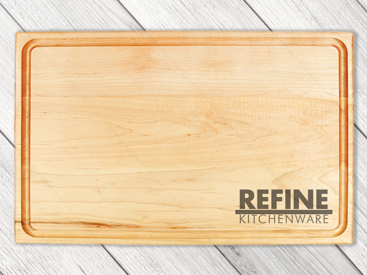 Custom logo cutting board by Refine Kitchenware, USA-made wooden board with visible branding on Tampa Home & Garden Store