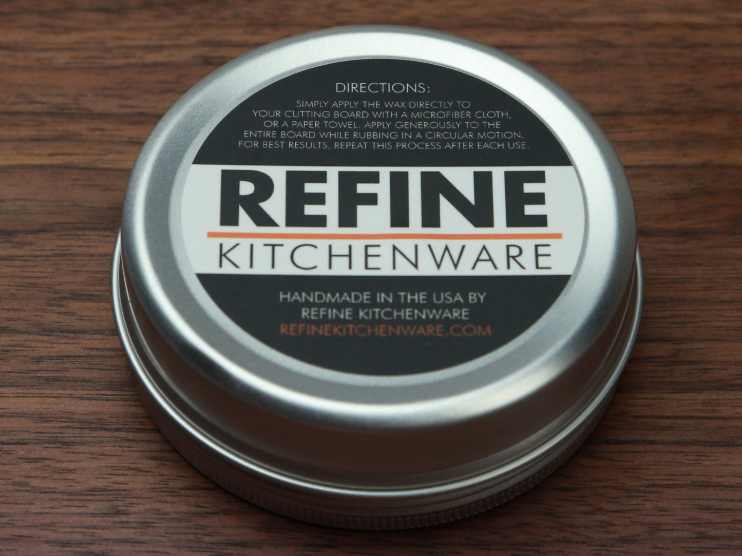 Cutting Board Wax tin by Refine Kitchenware; silver lid, orange accent label on wood on Tampa Home & Garden Store