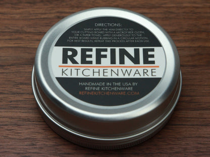 Cutting Board Wax tin by Refine Kitchenware; silver lid, orange accent label on wood on Tampa Home & Garden Store